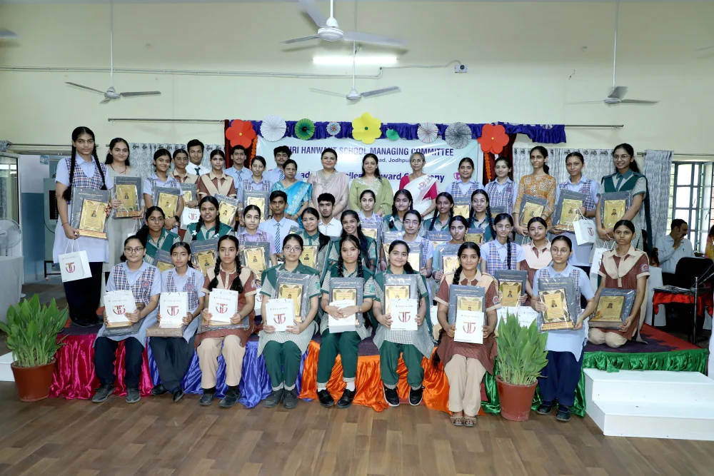 HSMC Academic Excellence Award Ceremony 2026 — group photo of RBSE board achievers with awards and school leadership