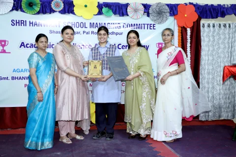 Awarded student with Mrs. Damayanti Kashyap, Mrs. Madhuri Singhal, Ms. Prerna Singhal and Mrs. Neelkamal Chouhan at the HSMC Academic Excellence Award Ceremony