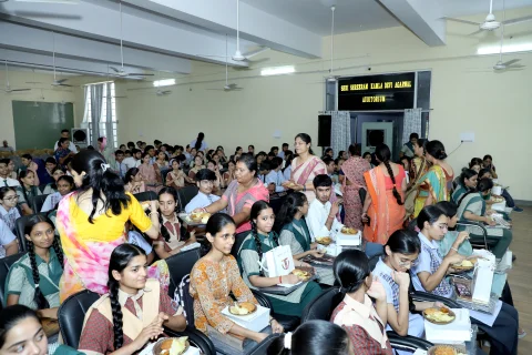 Audience and students in the BDRKA auditorium during the academic excellence award ceremony